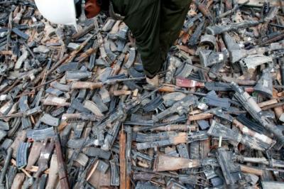 Rifles and pistols seized from drugs cartels and destroyed by members of the Mexican army