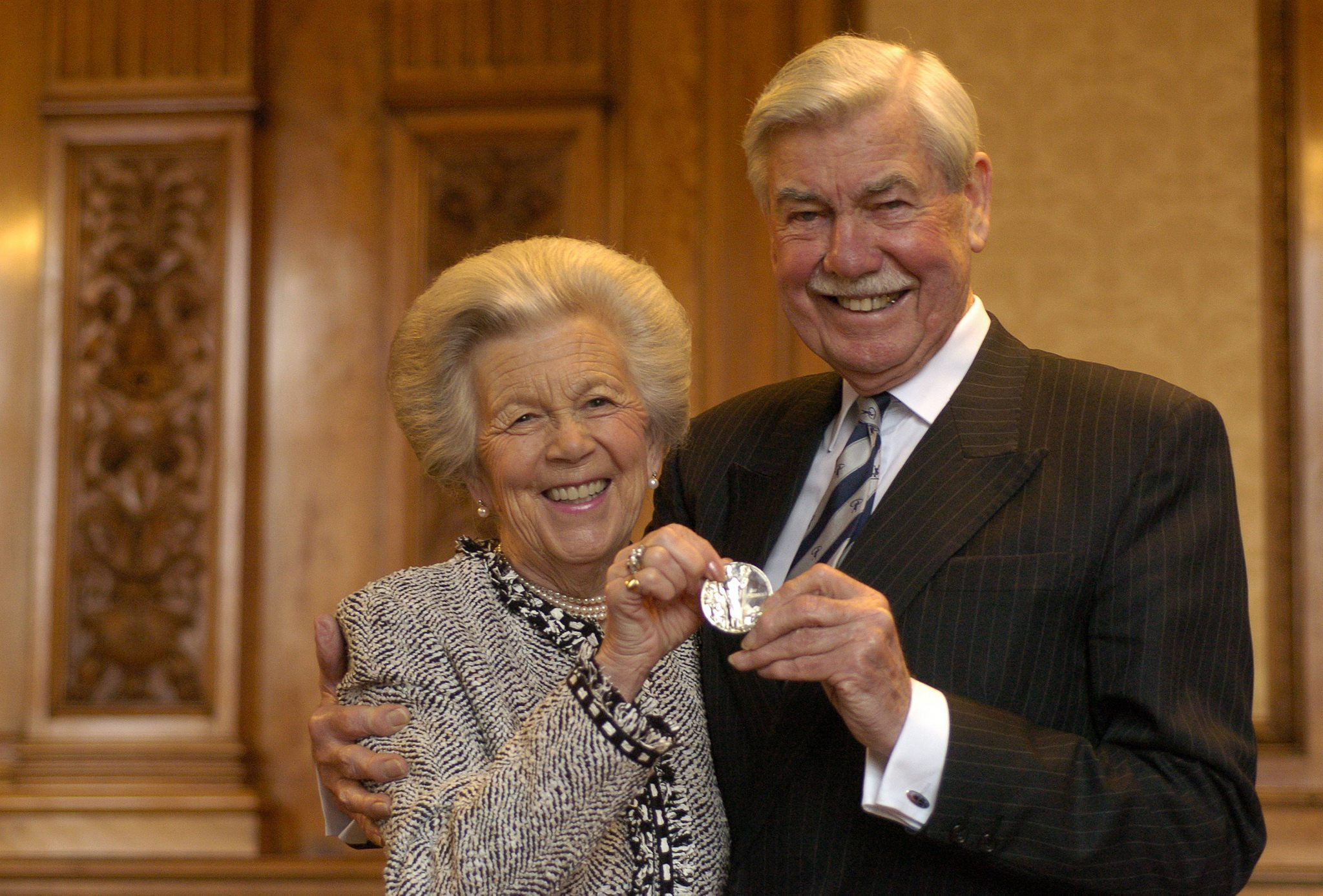 Lord Macfarlane of Bearsden holding the St Mungo prize medal after he was presented with the award by Lord Provost Liz Cameron at a presentation ceremony at the City Chambers in Glasgow. He is pictured with his wife Greta. 