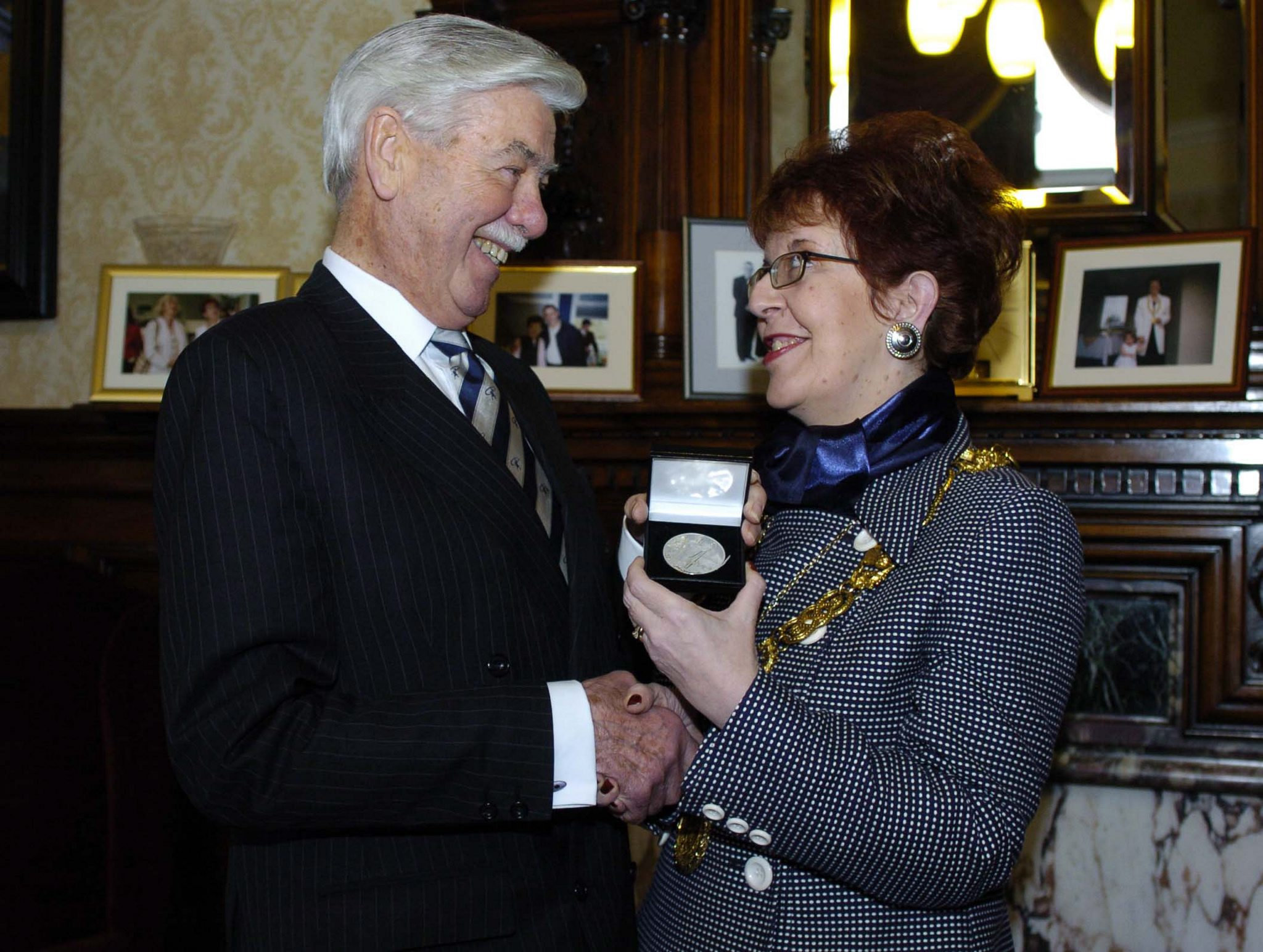 Provost Liz Cameron presents Lord Mcfarlane with the St Mungo Prize in recognition for his distinguished service to the City of Glasgow at the City Chambers.