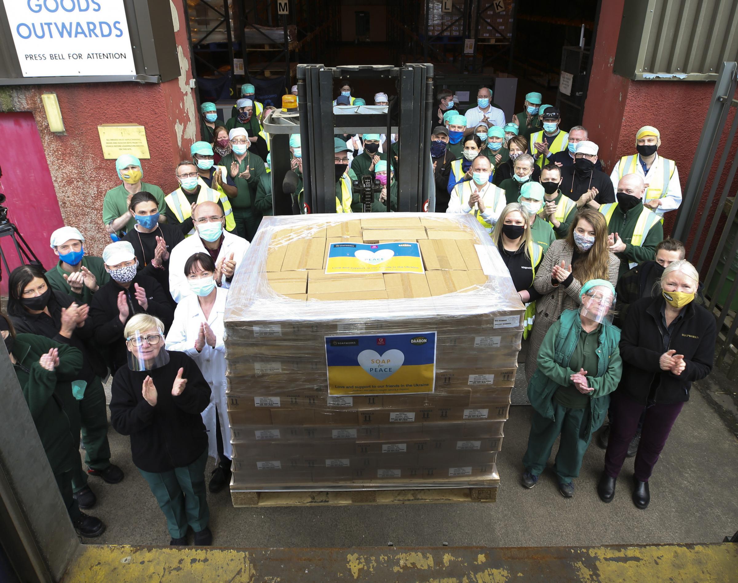 An aid lorry organised by Glasgow the Caring City with 47,000 bars of soap leaves the warehouse at Soapworks in the city heading for Ukraines refugees on the Polish border watched by the staff. Photo by Gordon Terris.