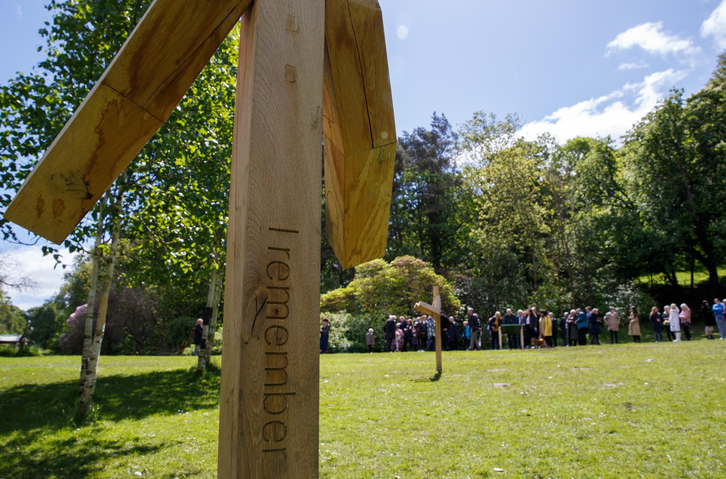 People pictured at Birch grove in Pollok Country Park. Birch Grove is one of the areas in the park where artist Alec Finlay has installed supports as part of the I Remember memorial. Photograph by Colin Mearns.