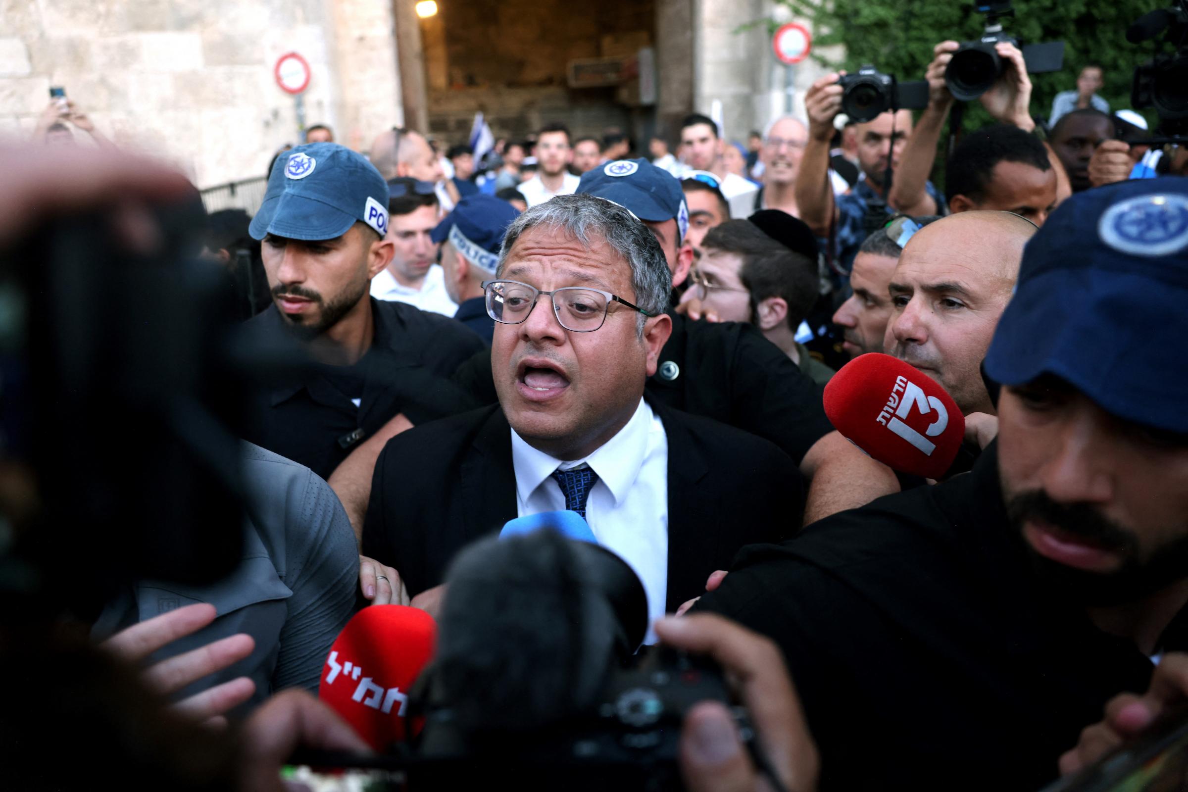 Israels National Security Minister Itamar Ben-Gvir speaks to the press as he joins Jewish nationalists, including far-right activists, rallying at Jerusalems Damascus Gate on June 5, 2024 during the so-called Jerusalem Day flag march, that
