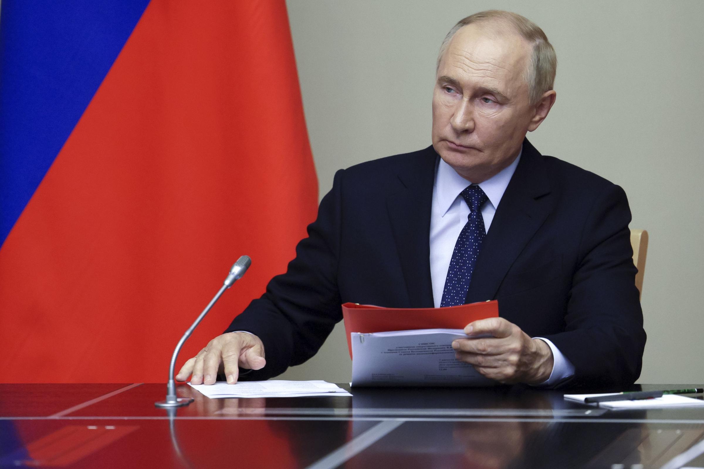 Russian President Vladimir Putin leads a meeting with Russian Security Councils members at the Novo-Ogaryovo state residence, outside Moscow, Russia, Friday, Aug. 9, 2024. (Aleksey Babushkin, Sputnik, Kremlin Pool Photo via AP).