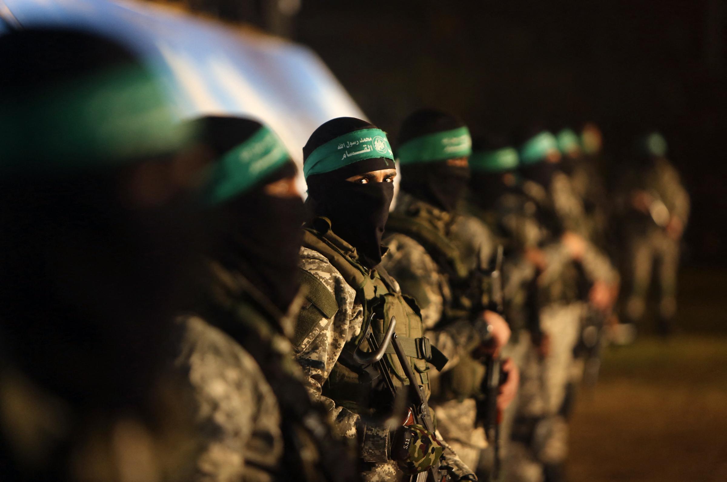 Palestinian members of the Ezzedine al-Qassam Brigades, the armed wing of the Hamas movement, take part in a gathering on January 31, 2016 in Gaza city to pay tribute to their fellow militants who died after a tunnel collapsed in the Gaza Strip. Seven