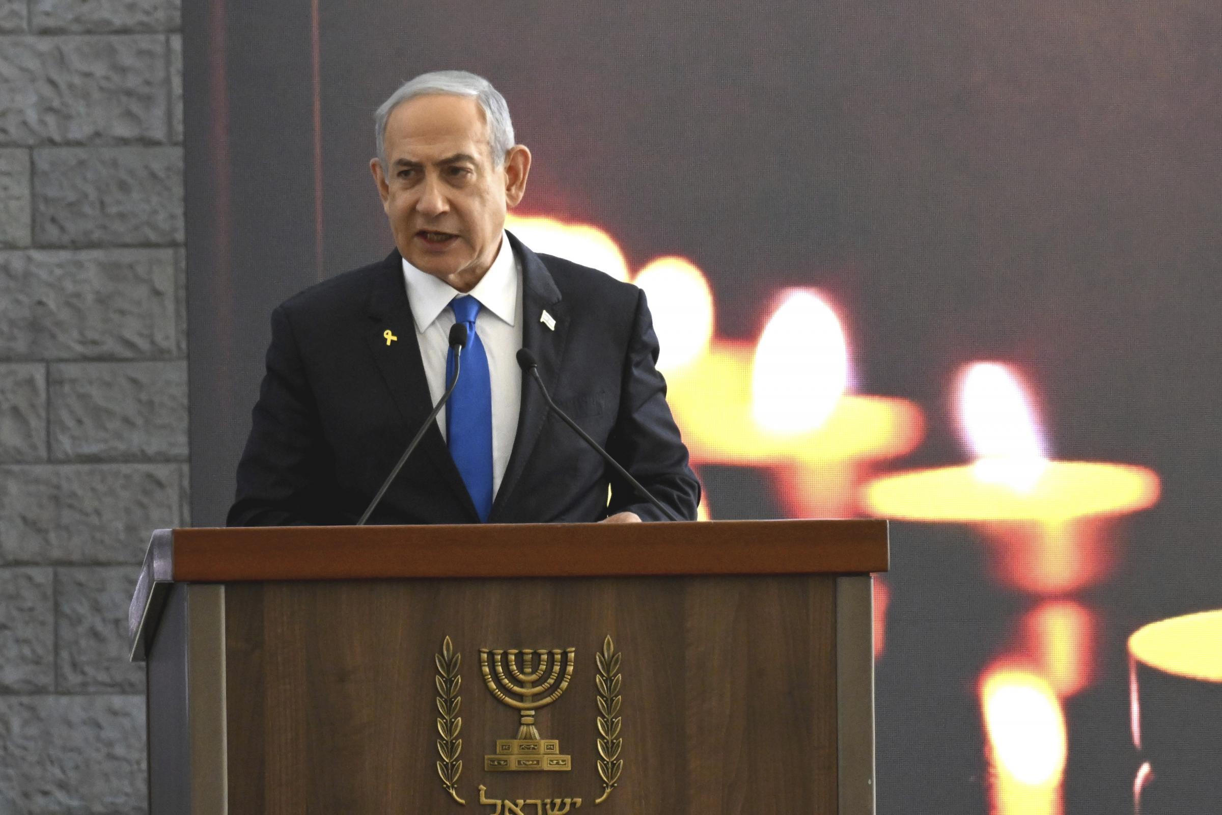 Israeli Prime Minister Benjamin Netanyahu speaks at a memorial ceremony for those killed by Hamas on Oct. 7, 2023, and those who fell in the Iron Sword war, at the Knesset, the Parliament, in Jerusalem, Monday, Oct. 28, 2024. (Debbie Hill, Pool Photo