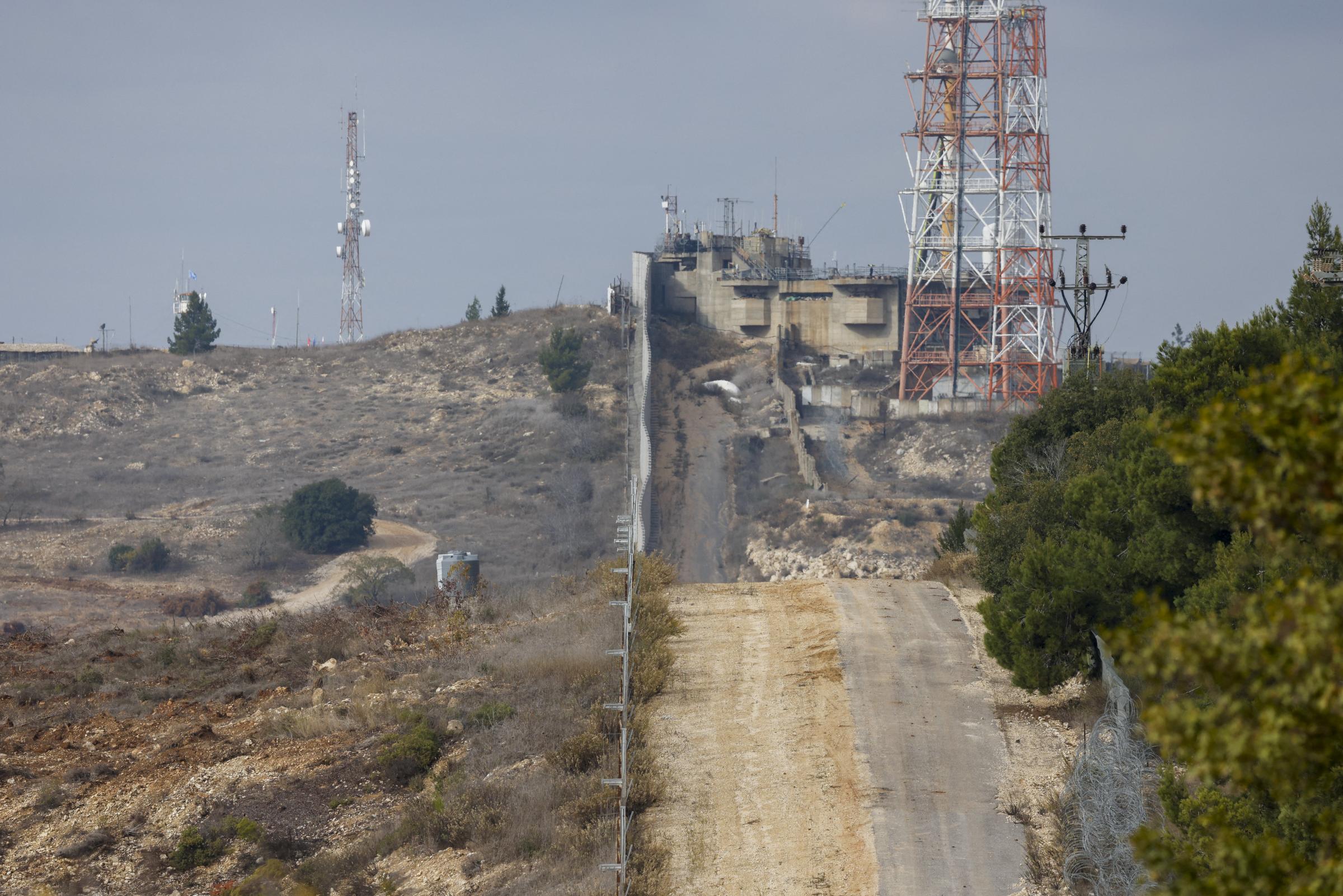 This picture taken from a position in northern Israel, on the border with Lebanon shows the border fence Lebanon (L) and Israel (R) on November 28, 2024. The Israeli military on November 28 said it hit a facility in southern Lebanon belonging to